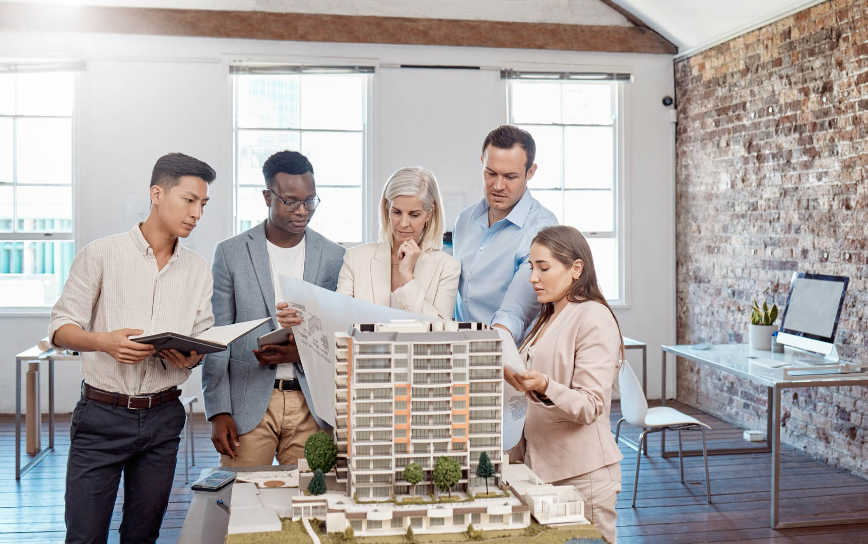 Diverse team of professionals collaborating on property advisory